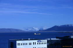 Fresh snow and a boat in the harbour, from the roof at work