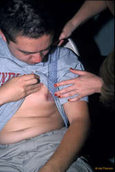 Newman getting his nipple measured