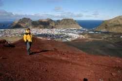 Karl standing on the summit of Eldfell, the town of Heimaey behind