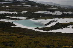 Turqoise meltwater pond on route 614
