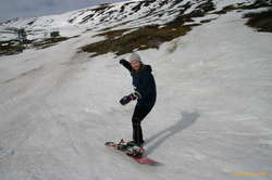 Alda learns to ride a snowboard