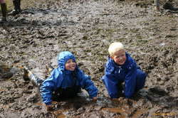 Einar and a friend playing in the mud
