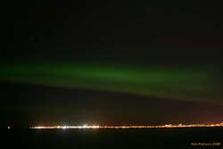 Aurora over Seltjarnarnes and Reykjavik, from Álftanes