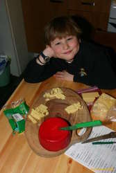 Einar posing with our cheese platter, top 3 are commercial, red is mine