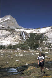Jess and a waterfall under North Peak