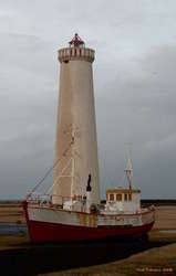 Old boat, new lighthouse